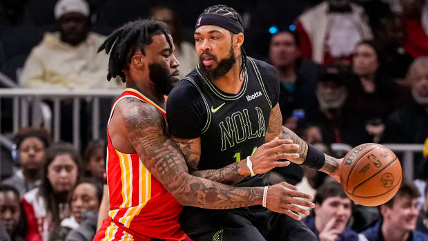 Mar 10, 2024; Atlanta, Georgia, USA; New Orleans Pelicans forward Brandon Ingram (14) dribbles guarded by Atlanta Hawks forward Saddiq Bey (41) during the first half at State Farm Arena. Mandatory Credit: Dale Zanine-USA TODAY Sports